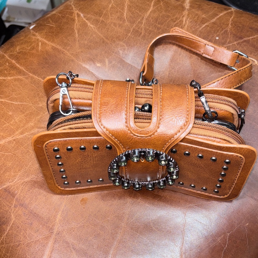 Chic Brown Leather Wristlet with Decorative Accents